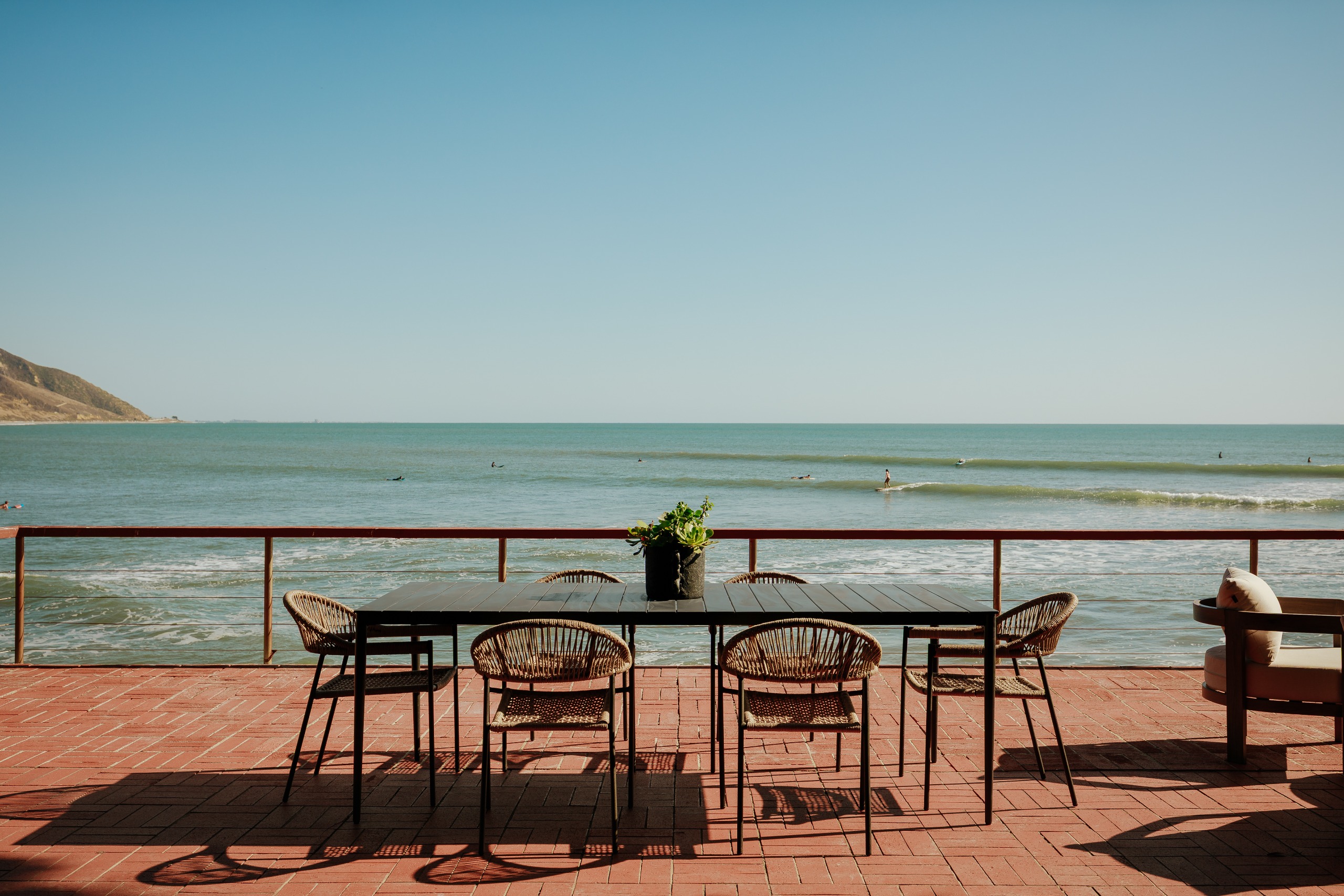 The living areas open onto a beachside terrace