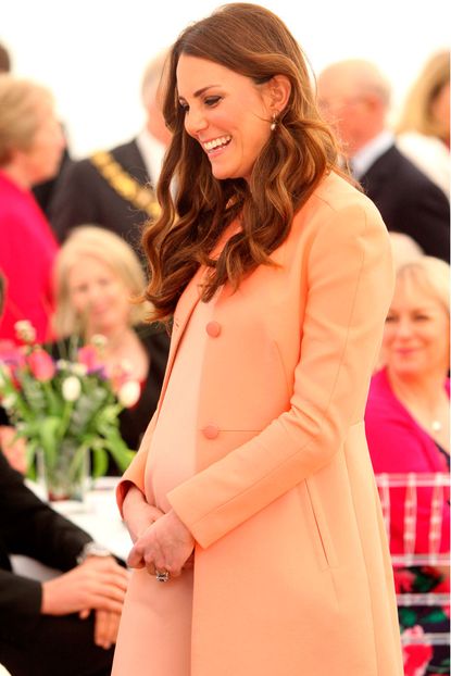 Kate Middleton wearing a coral coat