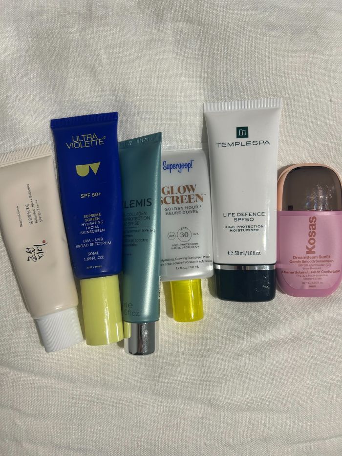 A picture of junior beauty editor Grace Lindsay's collection of glowy sunscreens
