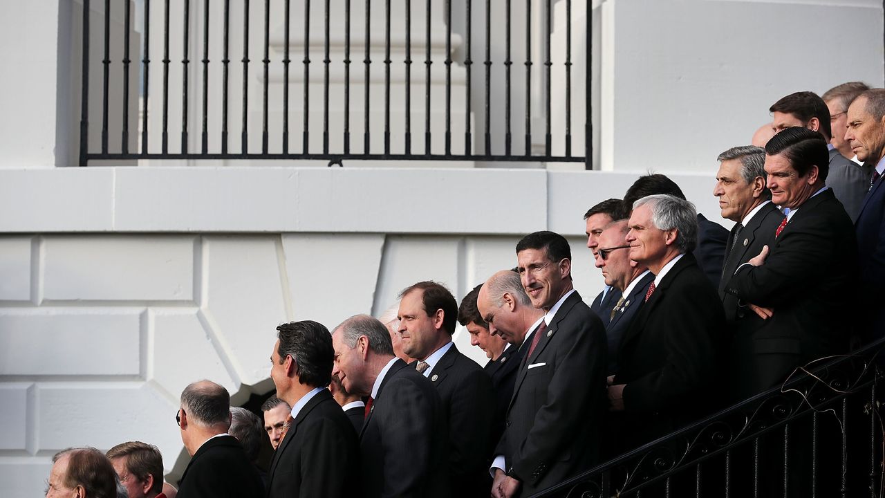 Republican members of Congress line the stairs on the south side of the White House during an event to celebrate Congress passing the Tax Cuts and Jobs Act December 20, 2017 