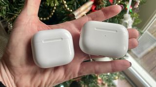 AirPods 4 and AirPods Pro 2, held together to show the differences