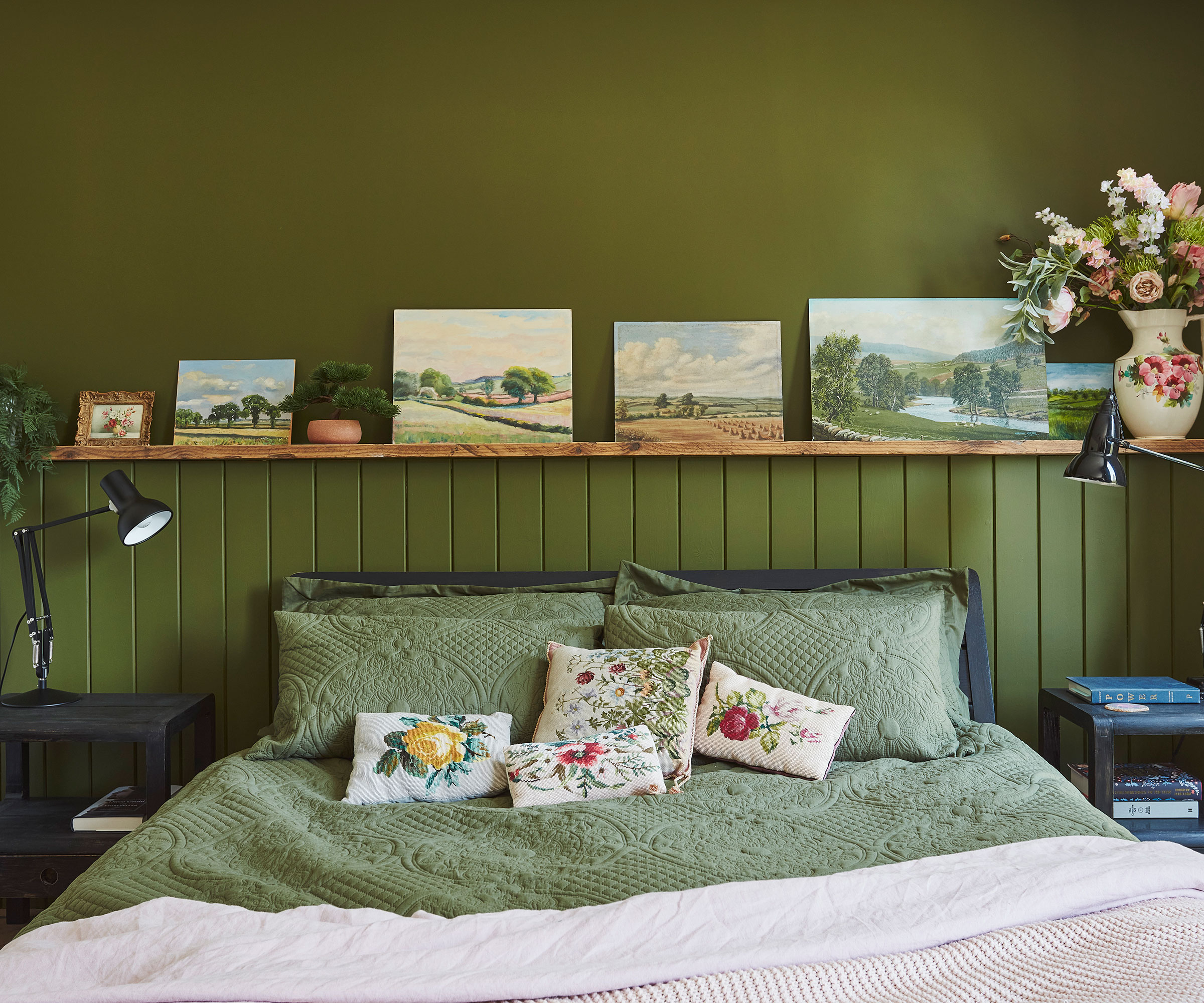 green master bedroom with wall panelling