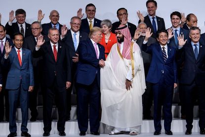 Trump and the Saudi crown prince shake hands in G-20 photo op