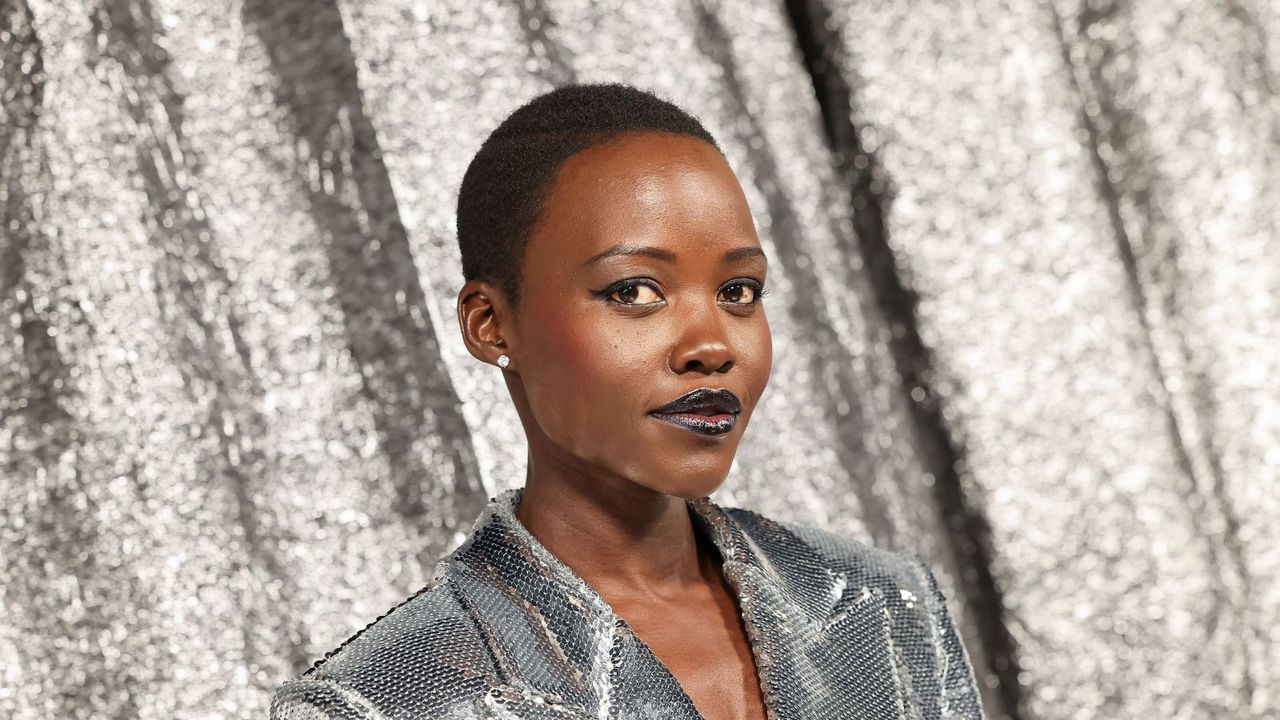 lupita nyong&#039;o on a silver background