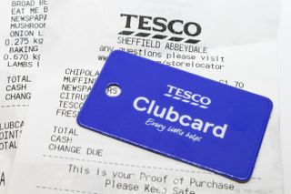 Tesco Clubcard keyfob laying on top of a receipt