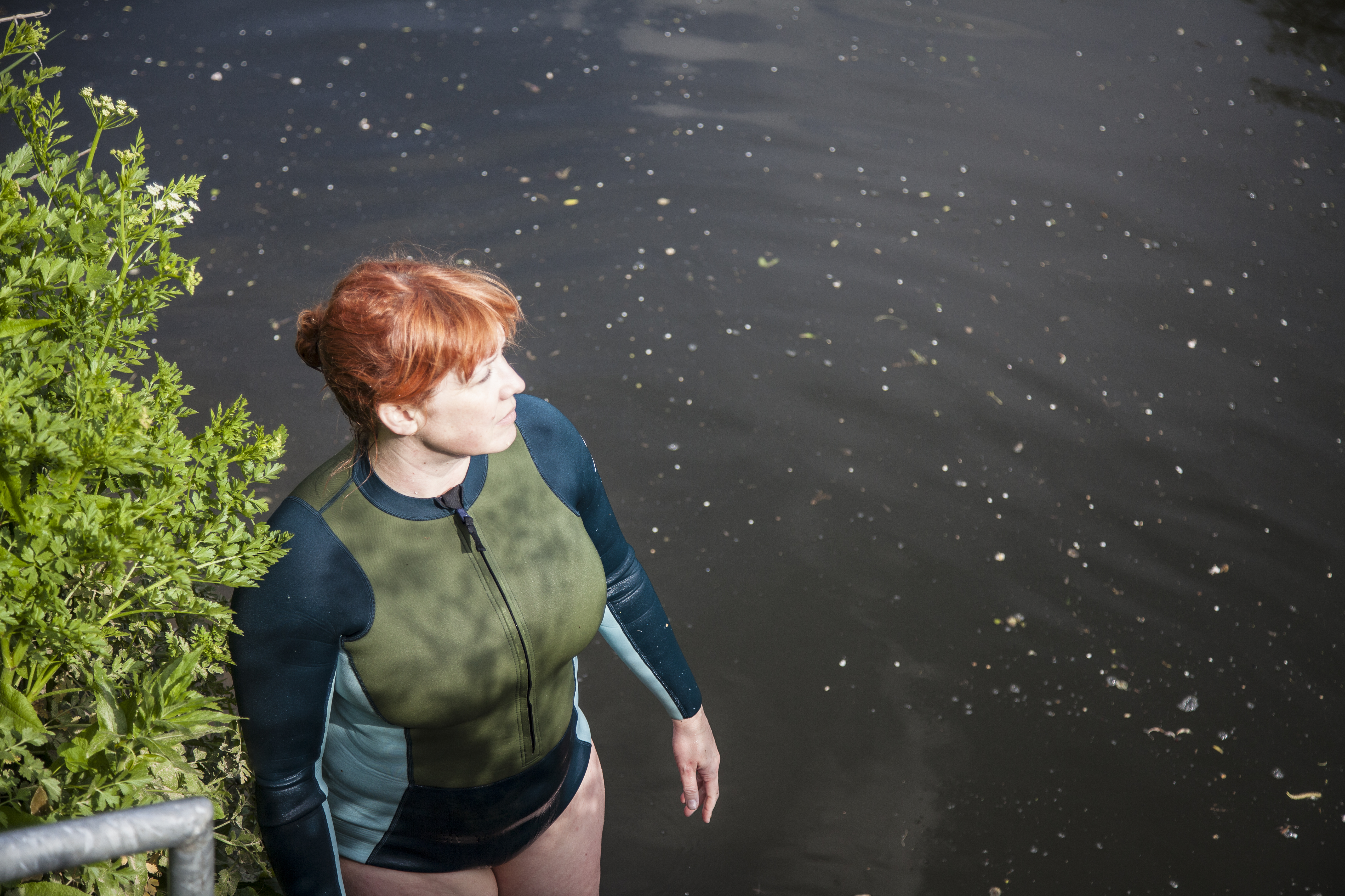 woman wearing Finisterre wetsuit, seen from above