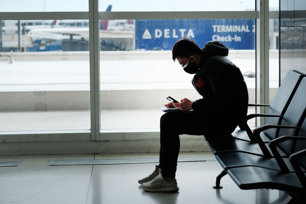 A man wears a mask at JFK Airport in New York City.