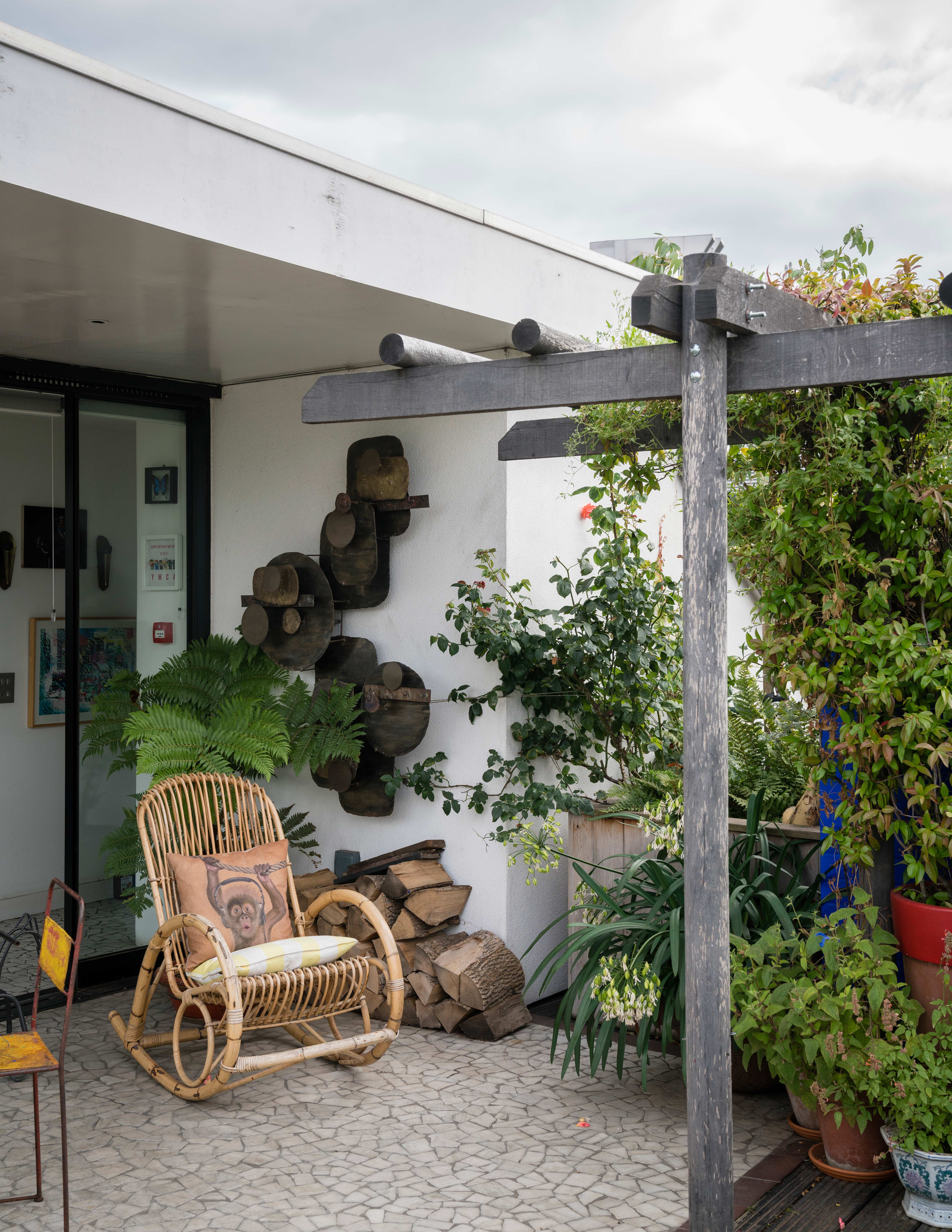 Small garden with pergola and climbing plants