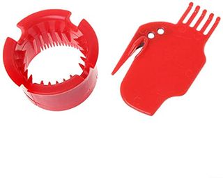 Two red pieces of lplastic designed to clean robot vacuum better brushes. One cylindrical with teeth inside, one flat with a small comb end, and a picking tool.