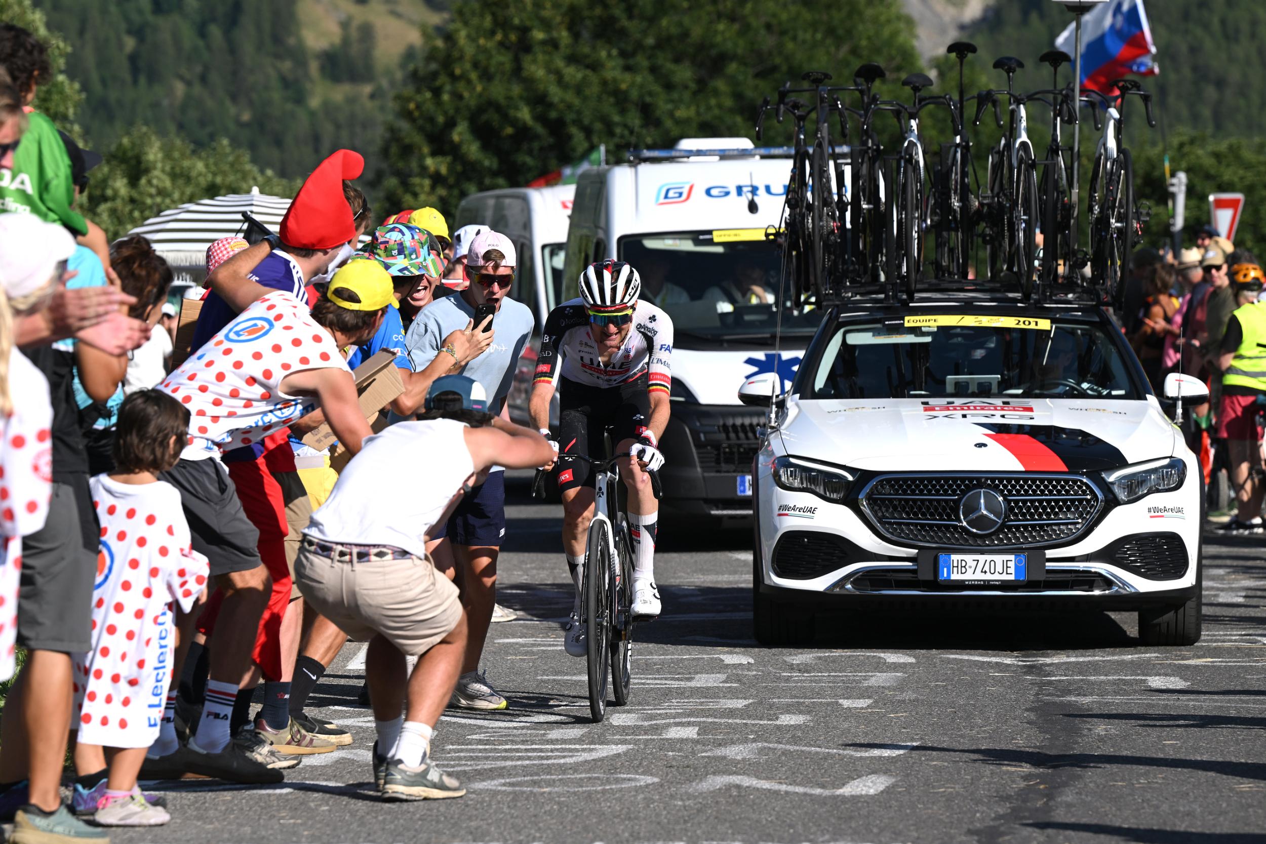 Tim Wellens rides in front of the broom wagon on stage 18 of the Tour de France 2026