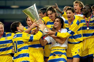 Parma celebrate with the trophy after winning the 1998/99 UEFA Cup