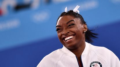 topshot usas simone biles reacts after competing in the artistic gymnastics balance beam event of the womens qualification during the tokyo 2020 olympic games at the ariake gymnastics centre in tokyo on july 25, 2021 photo by loic venance afp photo by loic venanceafp via getty images