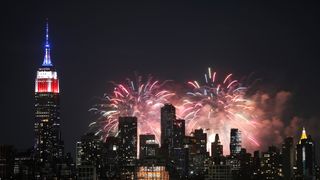 Fireworks explode next to the Empire State Building on the first of six nights of the Macy's Fourth of July fireworks shows in New York City on June 29, 2020 as seen from Jersey City, New Jersey.