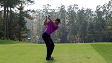 Tiger Woods hits his drive on the 10th hole at The Masters