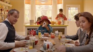 The Brown family and Paddington gathered in the kitchen in Paddington 2.