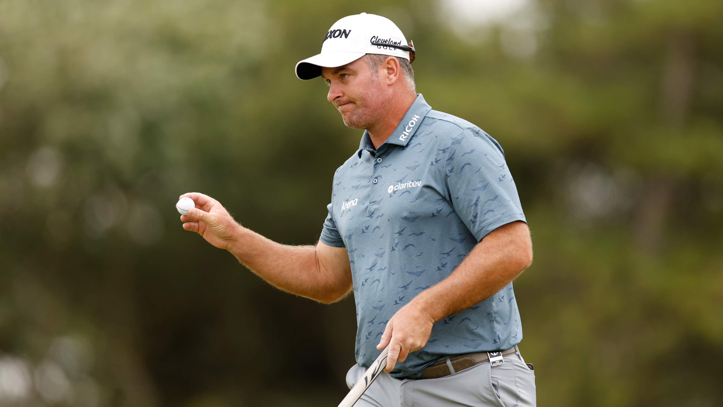 Ryan Fox acknowledges the crowd after holing a putt at the Open