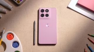 Moto G Stylus (2026) held in the hand with stylus.