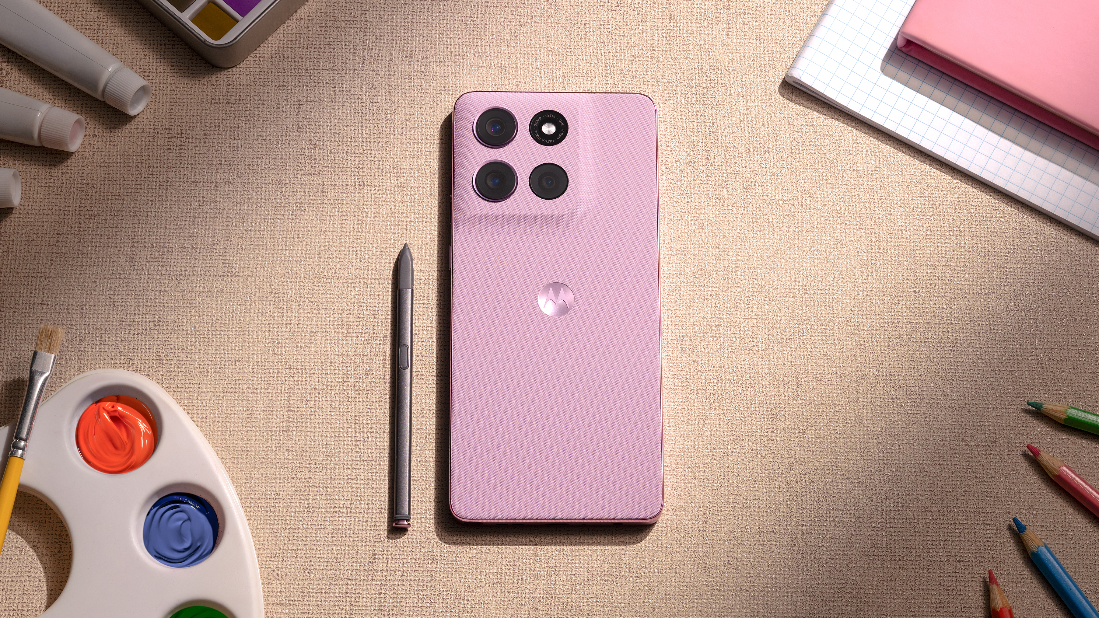 Moto G Stylus (2026) held in the hand with stylus.