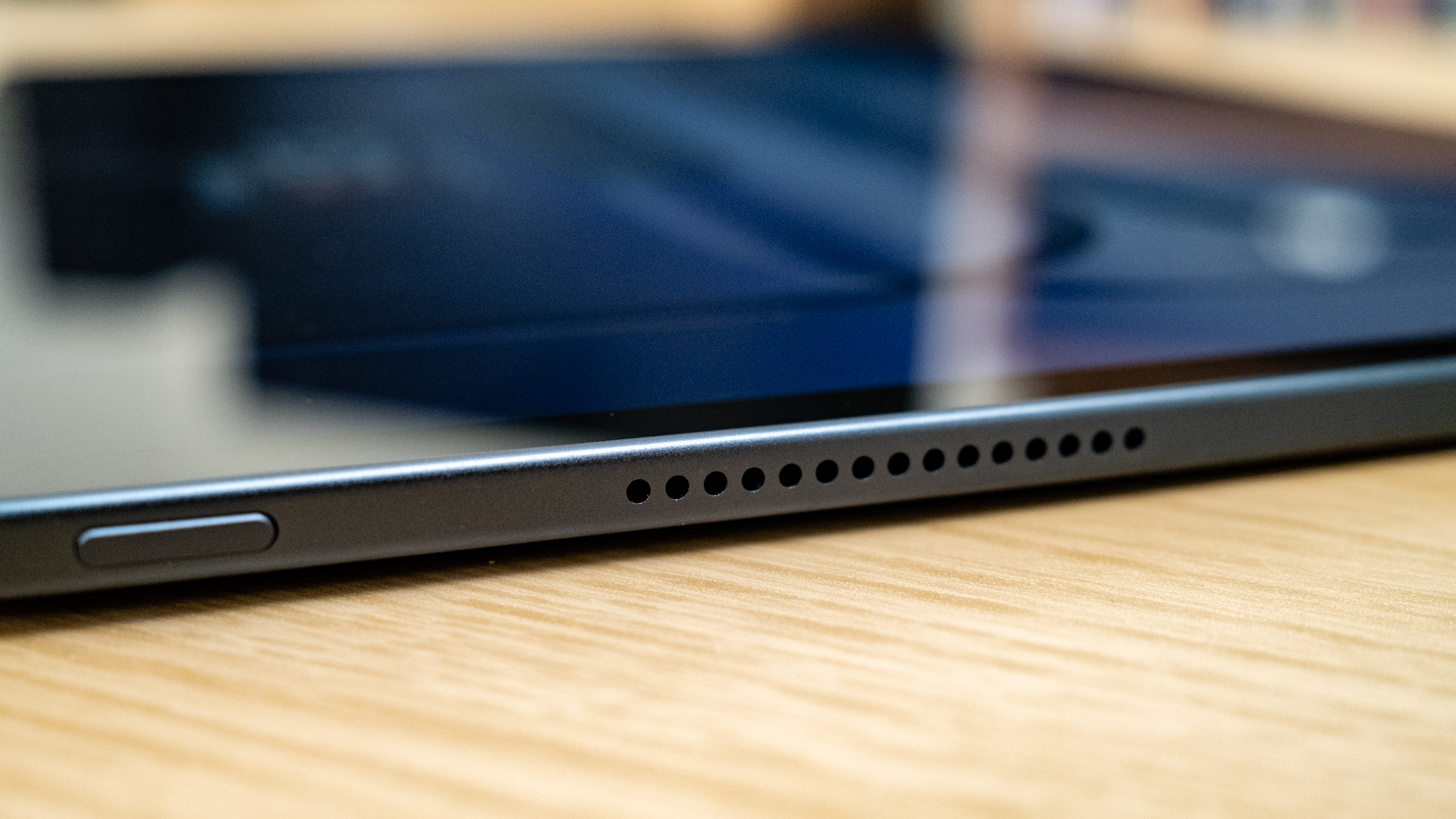 OnePlus Pad 3 speaker detail on a wooden table