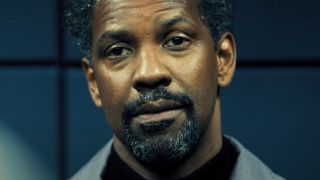 Denzel Washington sits while being questioned in Safe House.