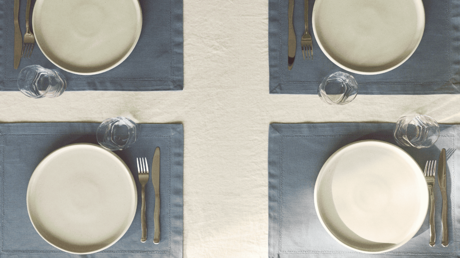 a gif of different tables set with H&M tableware including glasses, blue placemats, squiggly cutlery, bistro-style plates, and striped plates
