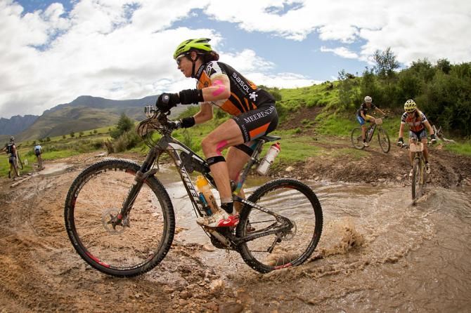 Ester Suss and Sally Bigham of team Meerendal cross a river