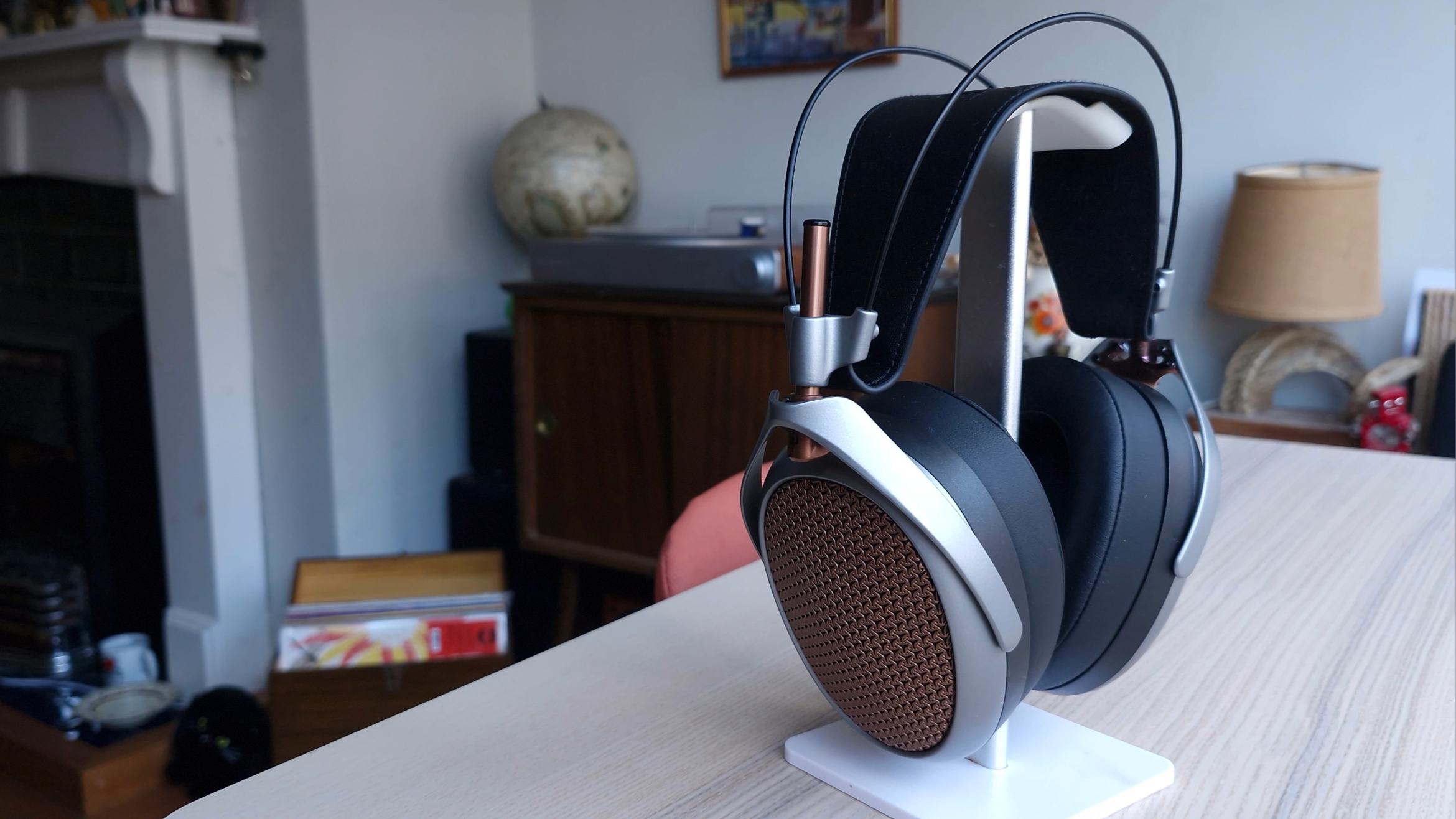 Meze Audio Poet open-back headphones on a wooden surface