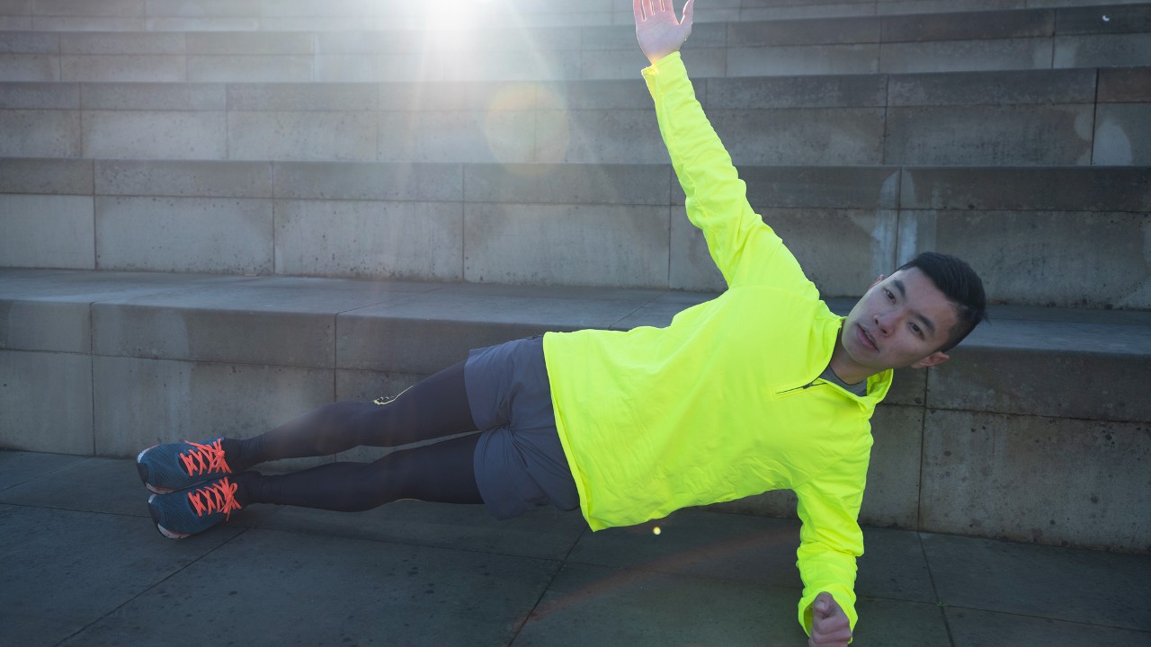 Runner performs side plank