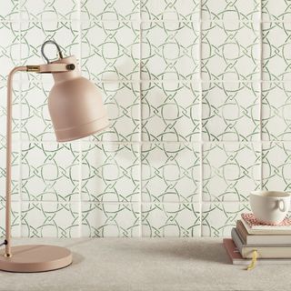 graphic wall tile with pink lamp teacup and books