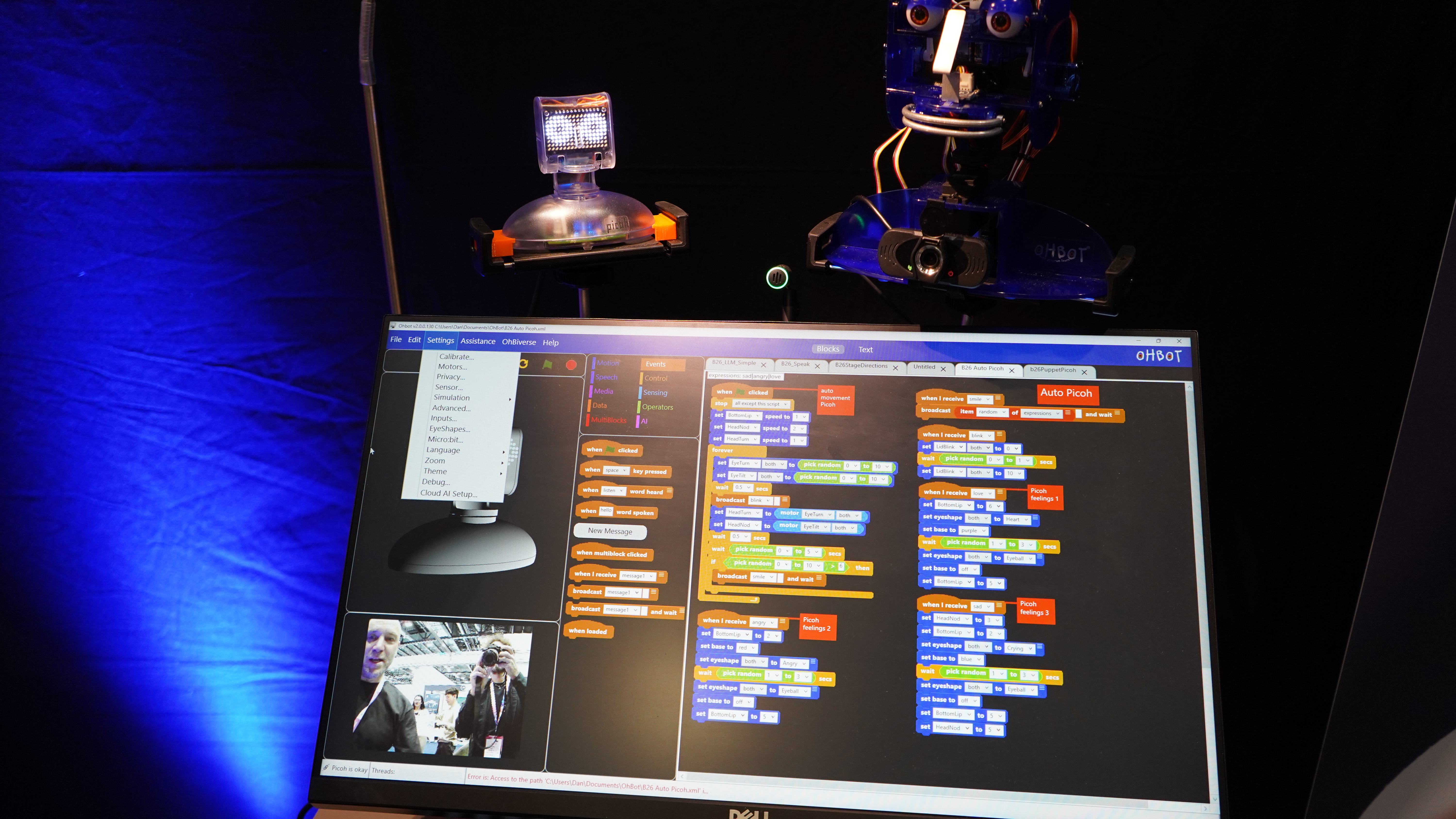 Ohbot robot heads and a computer display