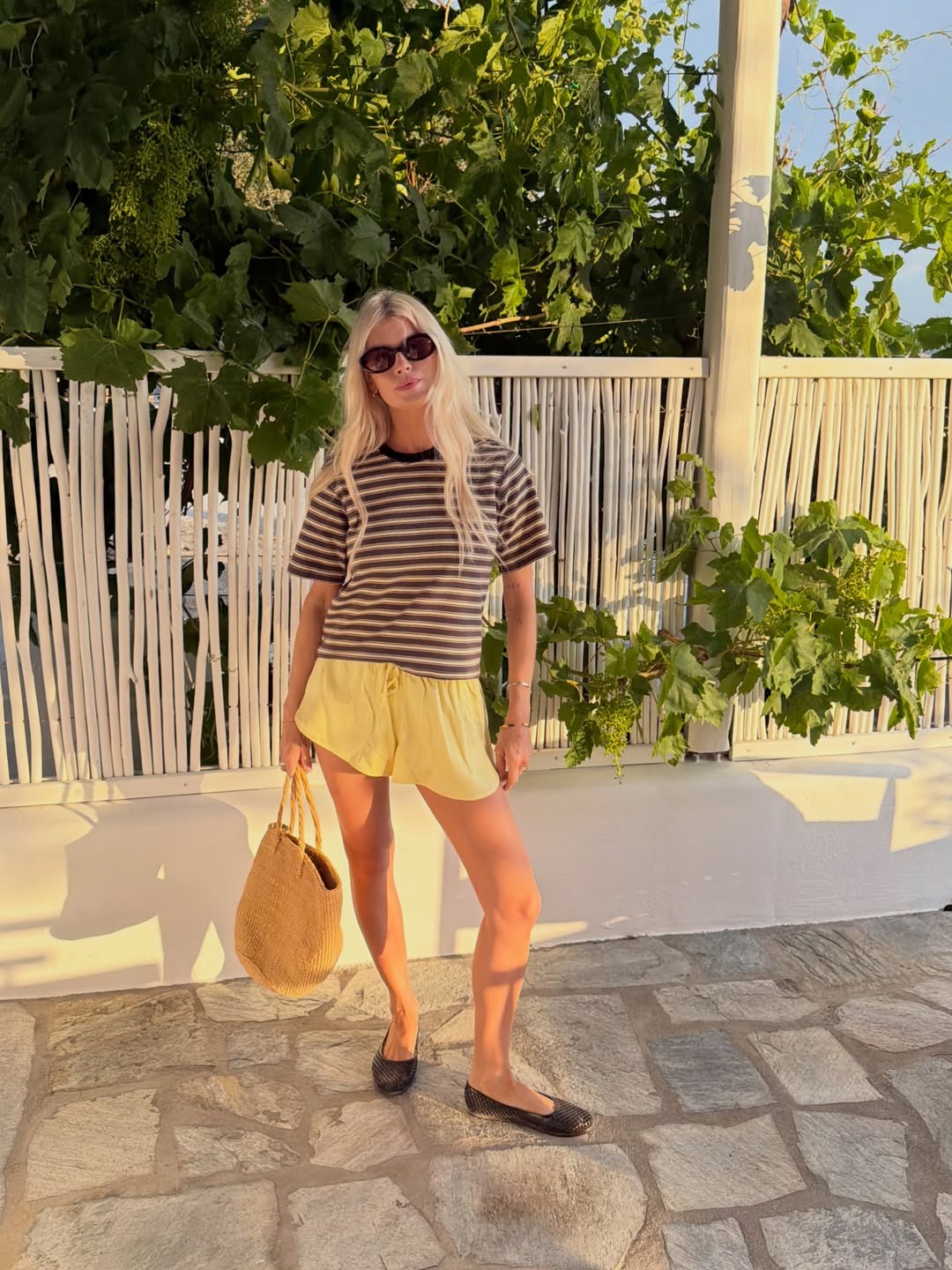 Woman in pull-on shorts and ballet flats.