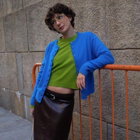 Influencer wearing colorful J.Crew sweaters