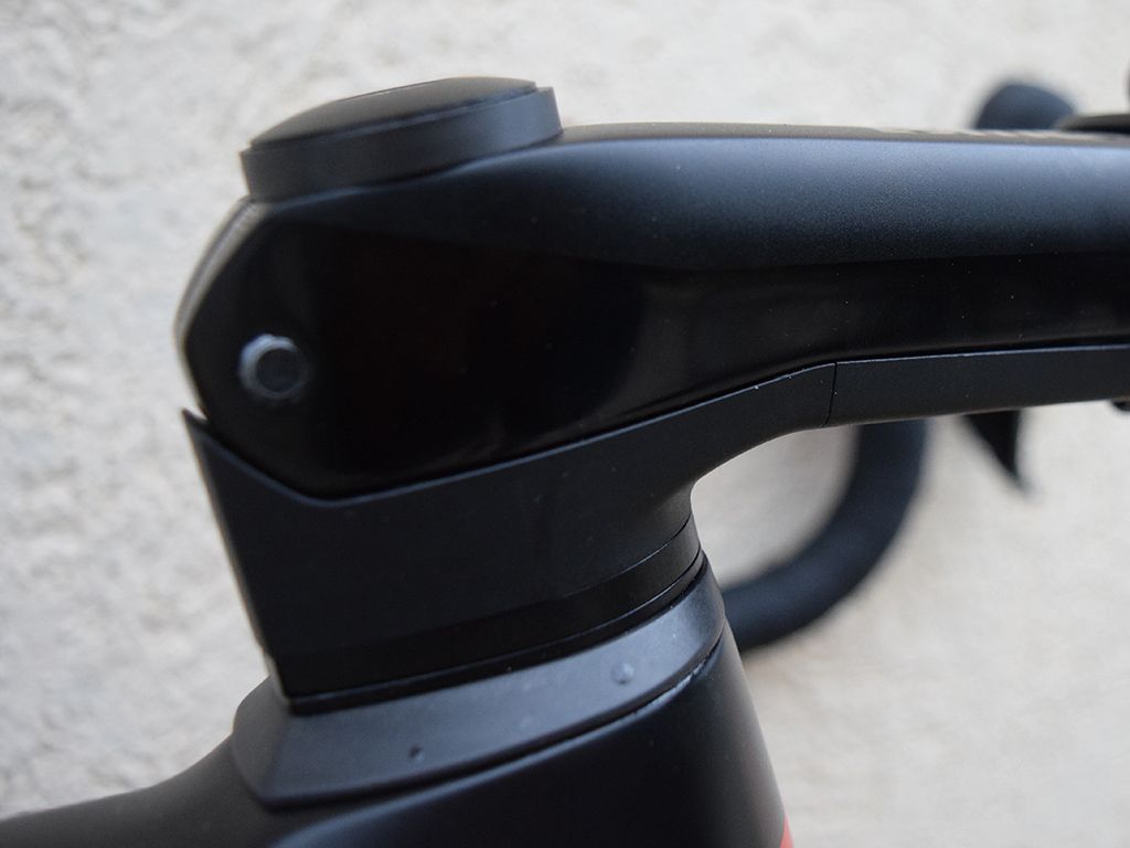 An integrated cockpit system allows front end adjustment while keeping the cables hidden away