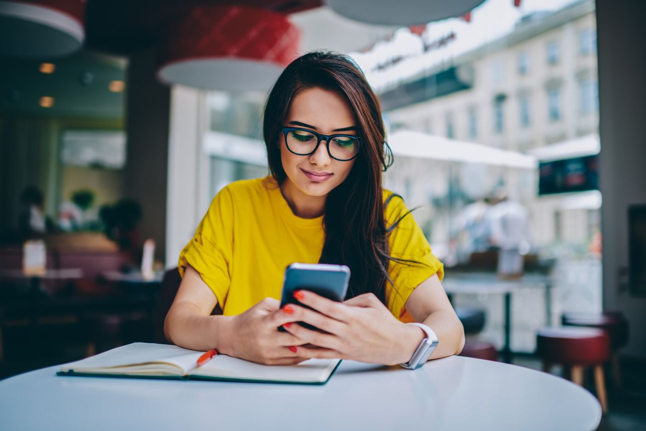 A woman looking at her phone.