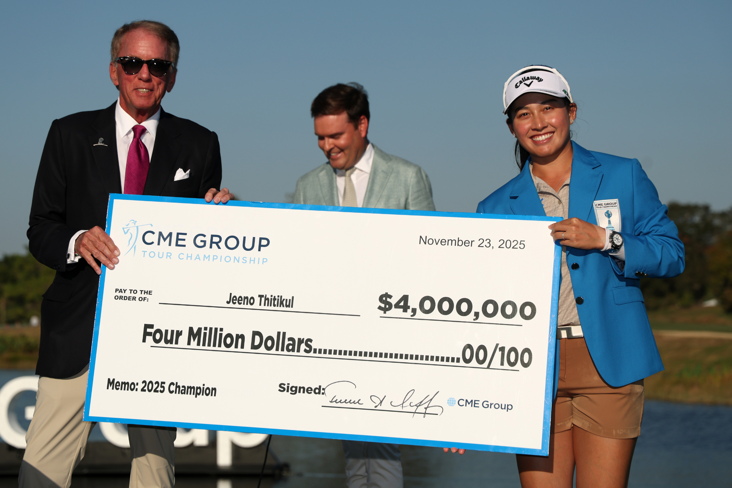 Jeenot Thitikul with a cheque after winning the CME Group Tour Championship in 2025