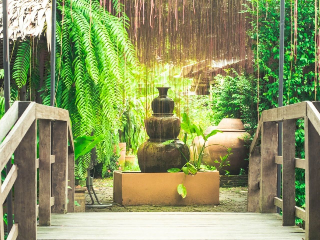 A stone fountain in a peaceful garden