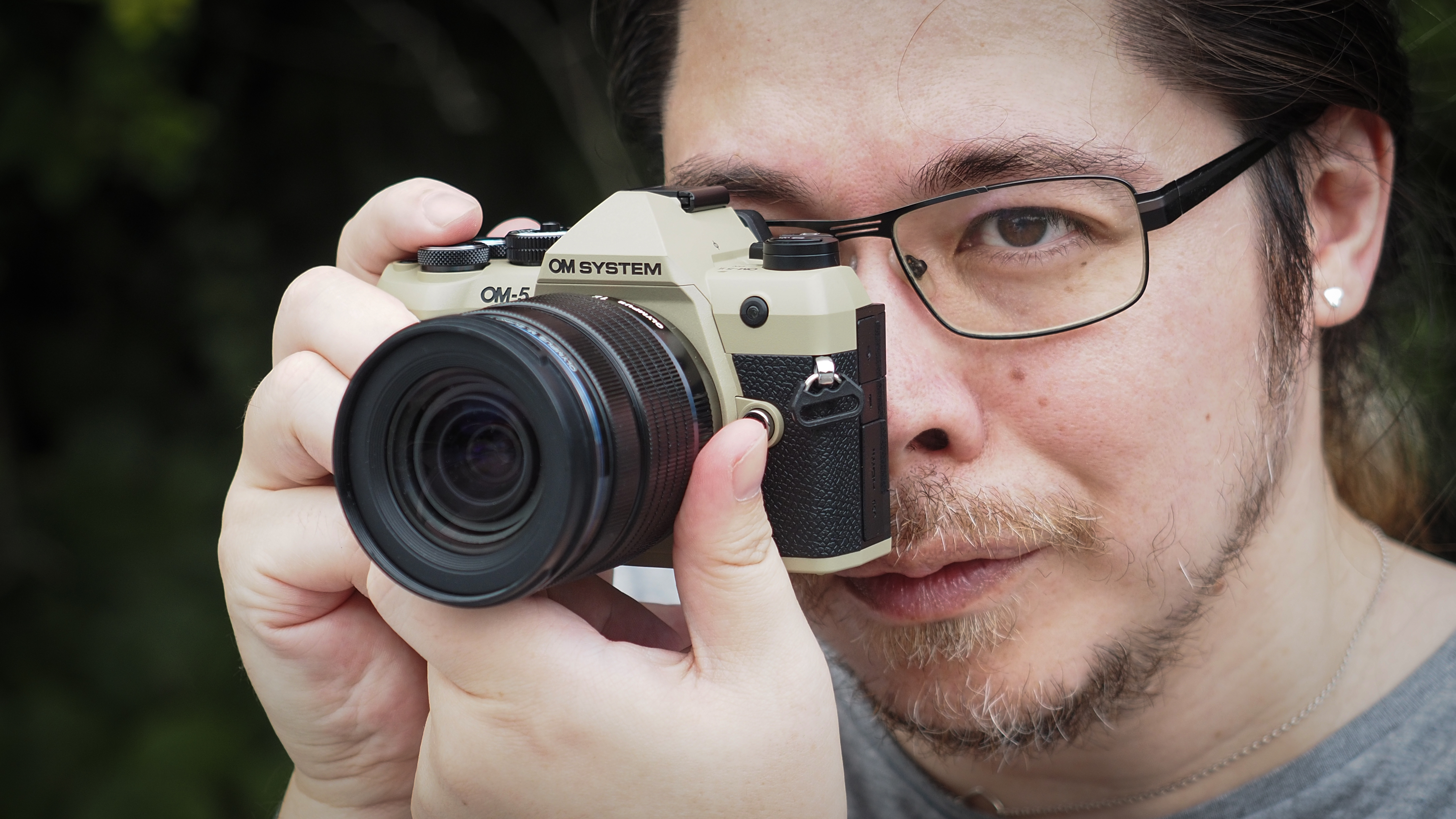 Photographer James Artaius using the OM System OM-5 Mark II