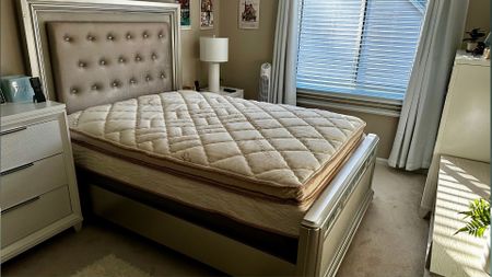 The image shows the Saatva Solaire Adjustable Firmness Mattress set up in our tester's home