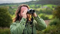 Expert holds one of the best binoculars while observing