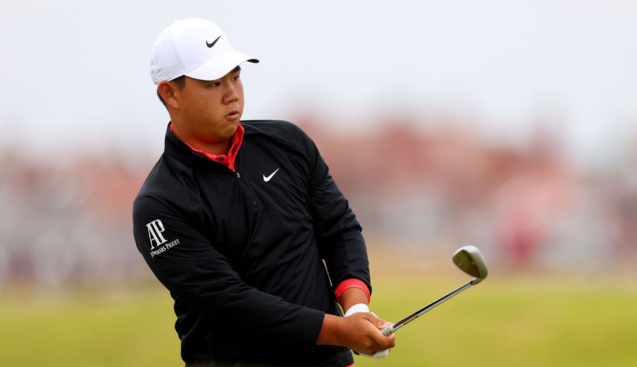 Tom Kim watches a chip shop