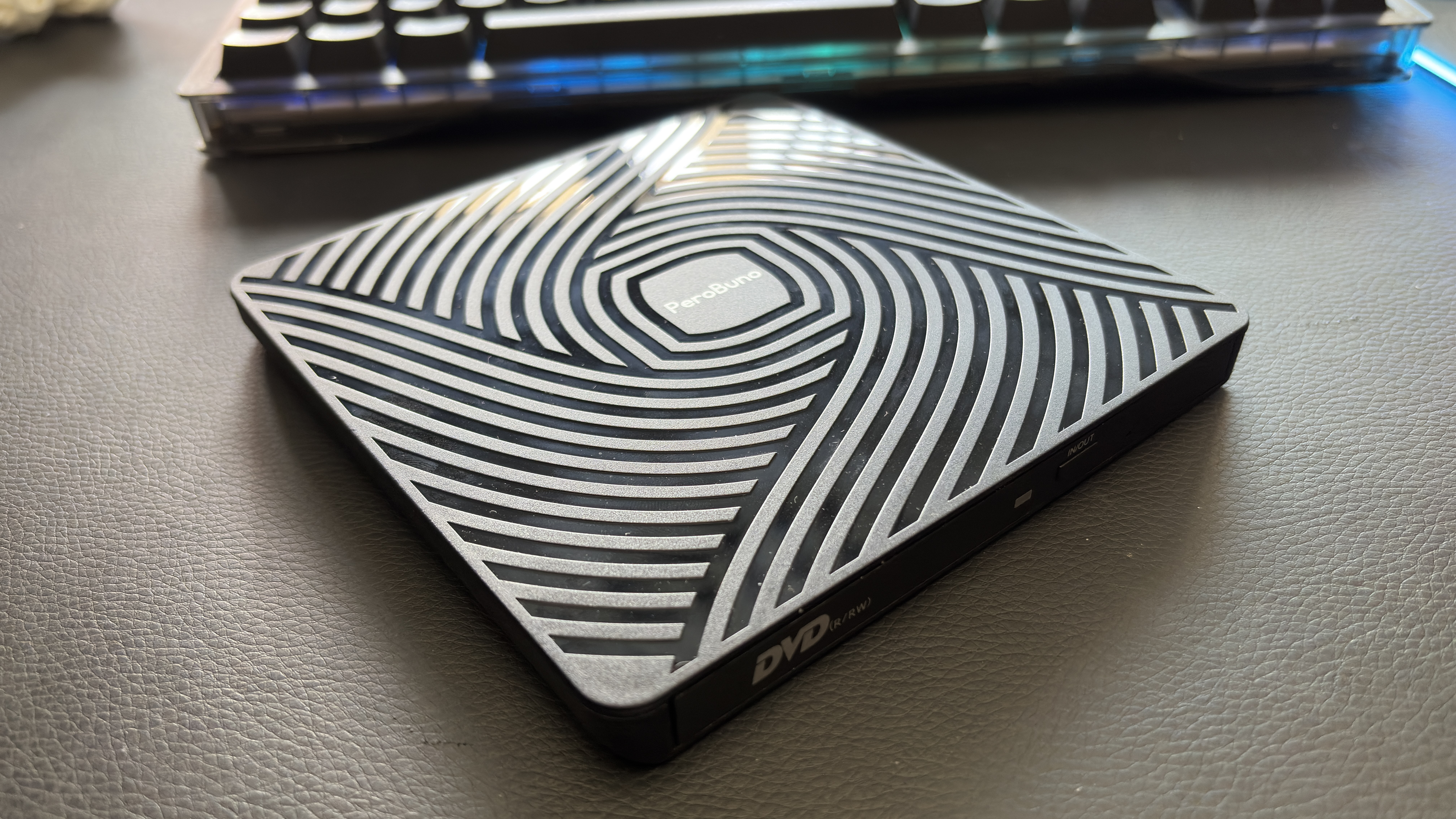 A PeroBuno disc drive on a desk.