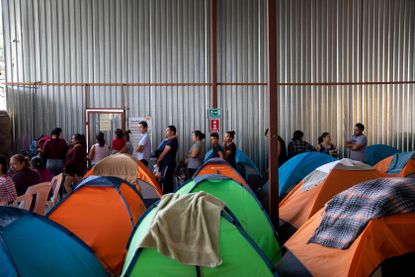 Migrants waiting for their claims to be processed by U.S. Immigration at a shelter in Tijuana.