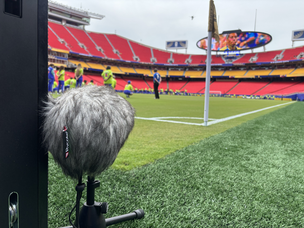 A field-level microphone sits on the perimeter behind the end line at Kansas City Stadium, also known as GEHA Field at Arrowhead Stadium.