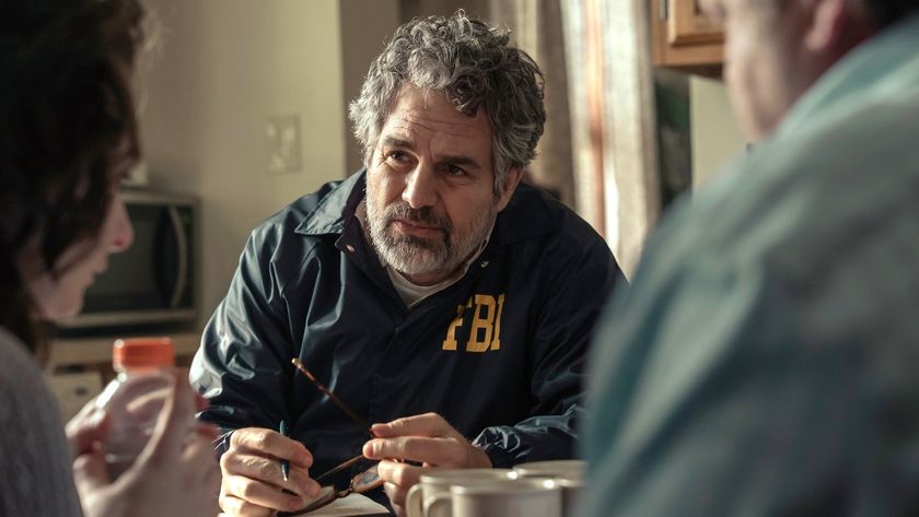 Mark Ruffalo sits across a table from some civilians in a scene from HBO Max&#039;s &quot;Task&quot; 