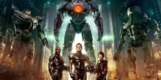 Pacific Rim Idris Elba, Charlie Hunnam, and Rinko Kikuchi armored up in front of their Jaegers