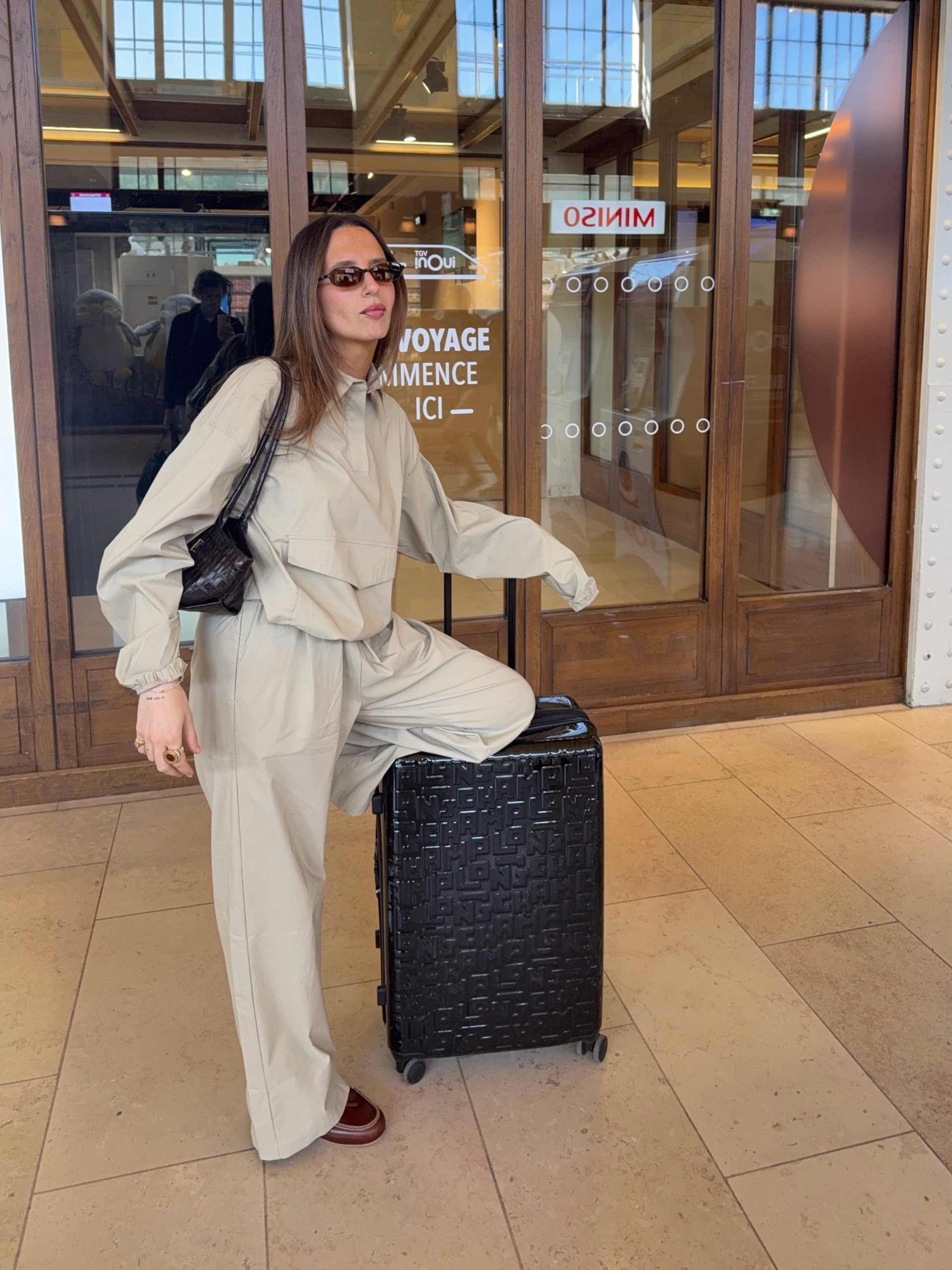 Woman wearing a business-class travel outfit.