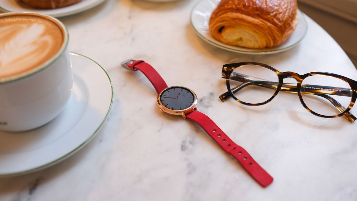 Photo of the Pebble Round 2 sitting on a marble counter surrounded by props.