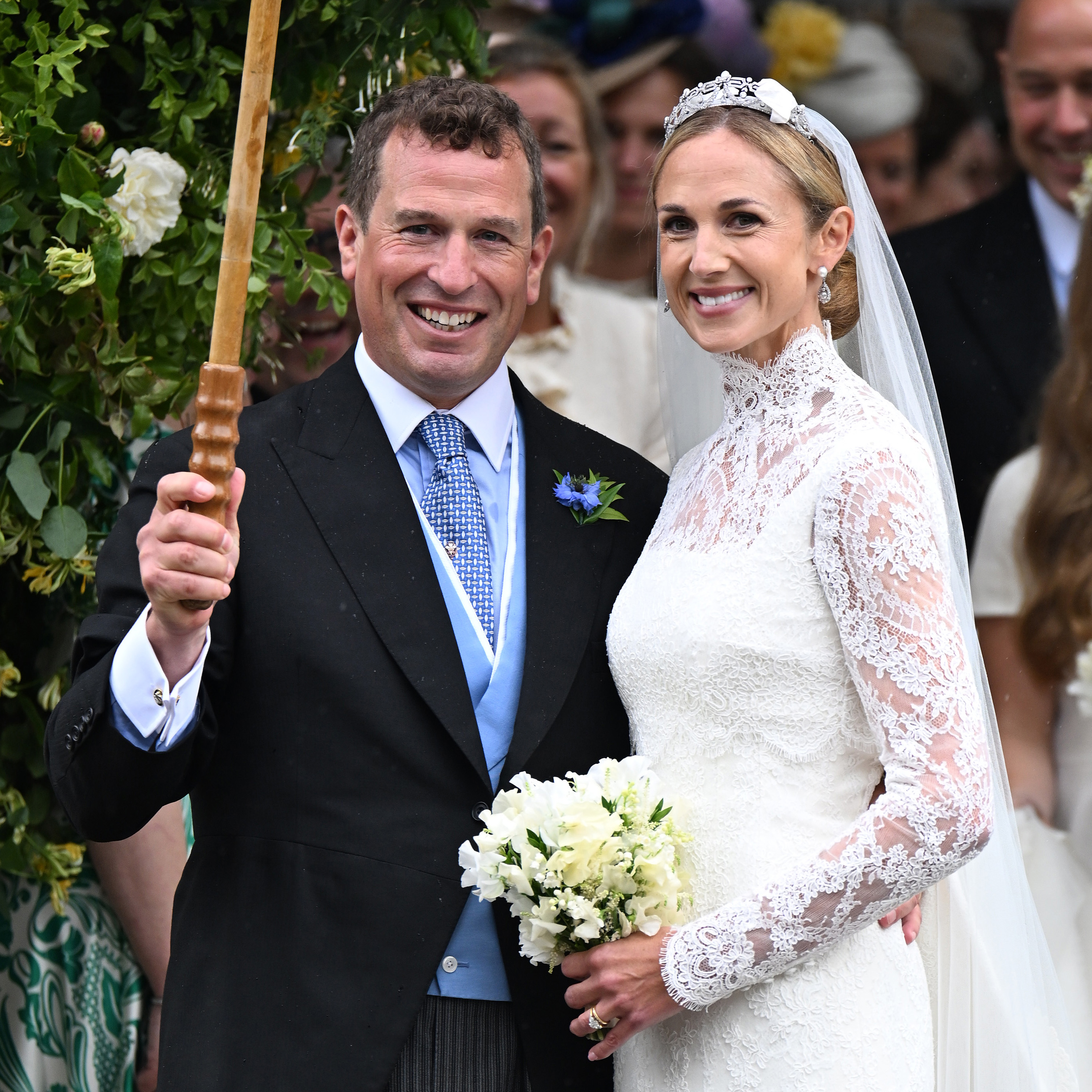 Harriet Sperling wears a diamond tiara at her wedding to Princess Anne's son, Peter Phillips, along with a cusom Emilia Wickstead lace wedding gown featuring a high neck and long sleeves
