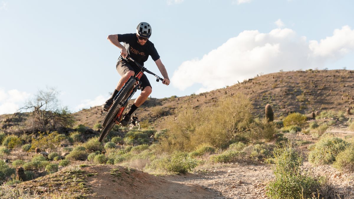 Revel Ranger bike being jumped on a desert trail