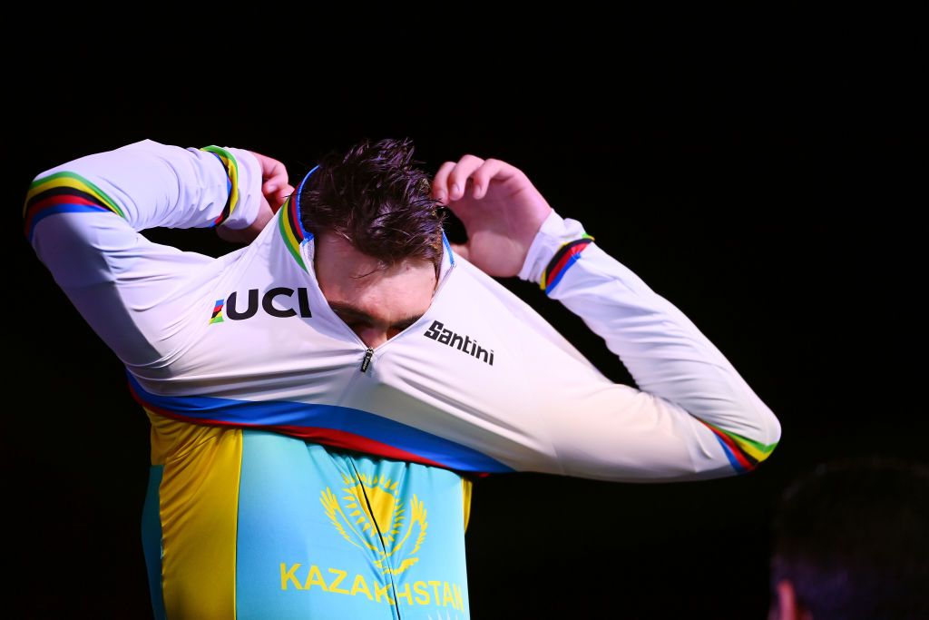 Yevgeniy Fedorov (Kazakhstan) pulls on the rainbow jersey